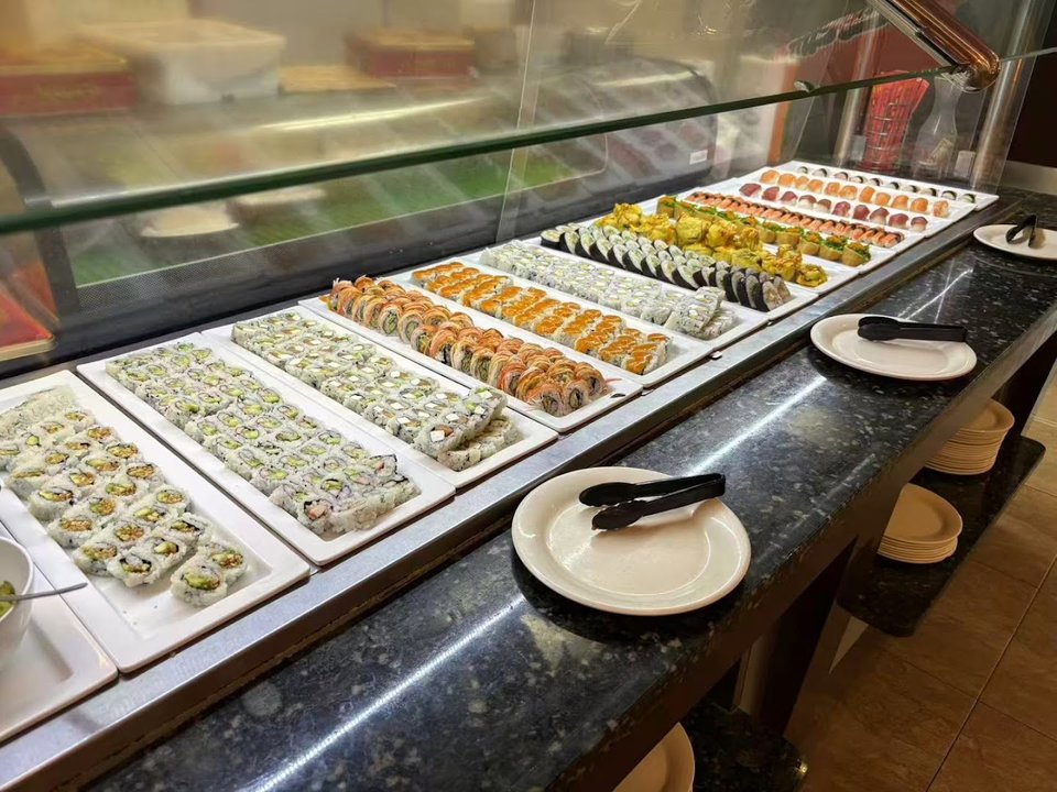 Guests choosing dishes from a buffet line